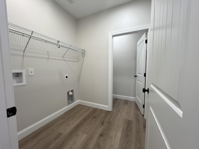 536 Sequoyah Dr, Morristown, TN 37813 - laundry area featuring wood finished floors, hookup for an electric dryer, washer hookup, and baseboards