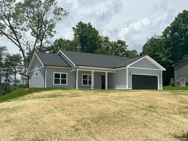 536 Sequoyah Dr, Morristown, TN 37813 - view of front facade with a garage, a front lawn, and covered porch