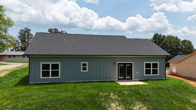 536 Sequoyah Dr, Morristown, TN 37813 - back of house with board and batten siding, a lawn, french doors, and roof with shingles