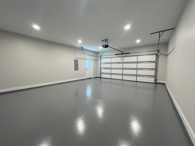 536 Sequoyah Dr, Morristown, TN 37813 - garage featuring electric panel, recessed lighting, baseboards, and a garage door opener