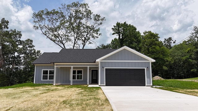 536 Sequoyah Dr, Morristown, TN 37813 - view of front of house with an attached garage, a front yard, driveway, and a shingled roof