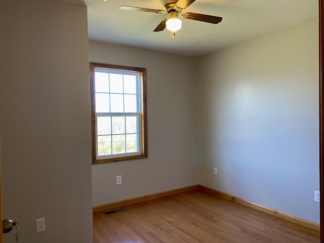 spare room featuring ceiling fan and light wood-type flooring