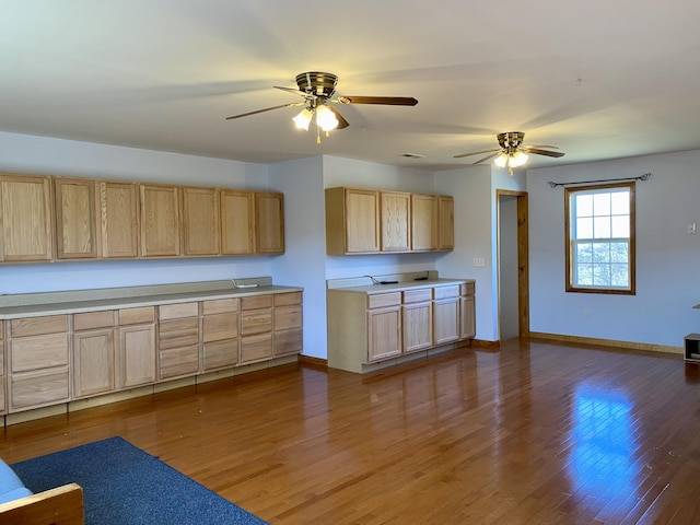 kitchen with ceiling fan, hardwood / wood-style floors, and light brown cabinetry