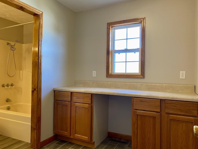 bathroom with shower / bathtub combination and hardwood / wood-style floors