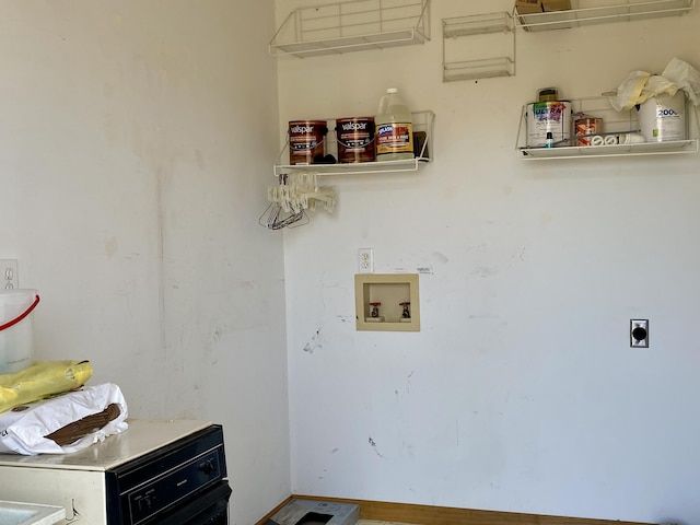 laundry room featuring electric dryer hookup and washer hookup