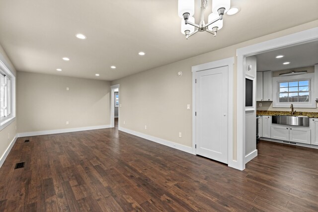 empty room with a sink, recessed lighting, and visible vents
