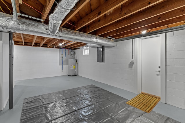 basement featuring water heater and electric panel