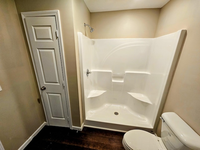269 Buttercup Fields Rd, Newport, TN 37821 - full bathroom featuring a shower, toilet, wood finished floors, and baseboards