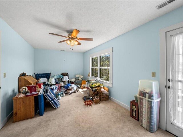 702 John Sevier Dr, Sevierville, TN 37876 - game room with a textured ceiling, a ceiling fan, visible vents, carpet flooring, and baseboards