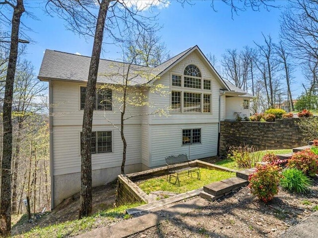 702 John Sevier Dr, Sevierville, TN 37876 - back of house featuring roof with shingles