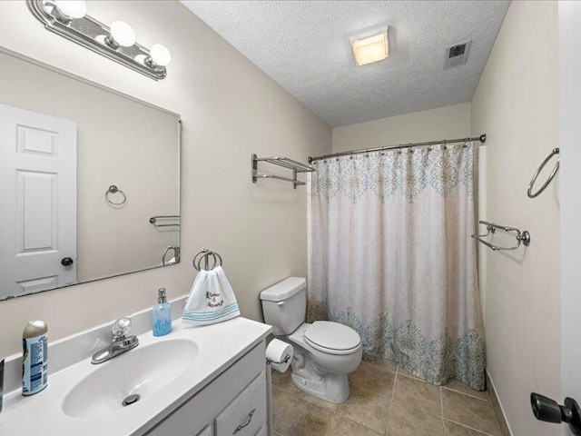 702 John Sevier Dr, Sevierville, TN 37876 - full bath featuring visible vents, toilet, a textured ceiling, vanity, and tile patterned floors