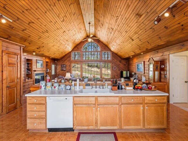 702 John Sevier Dr, Sevierville, TN 37876 - kitchen featuring open floor plan, dishwasher, a sink, and wooden walls