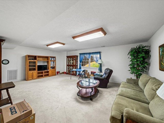 702 John Sevier Dr, Sevierville, TN 37876 - living room with light carpet, baseboards, visible vents, and a textured ceiling