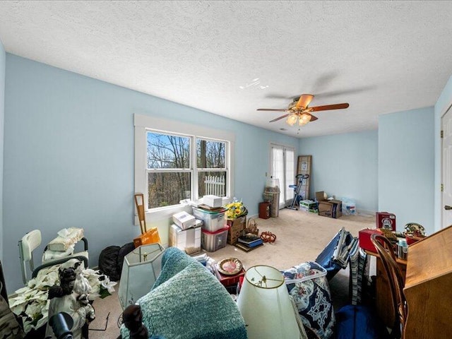 702 John Sevier Dr, Sevierville, TN 37876 - carpeted dining space with a ceiling fan and a textured ceiling