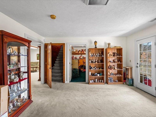 702 John Sevier Dr, Sevierville, TN 37876 - interior space with visible vents, a textured ceiling, and stairs