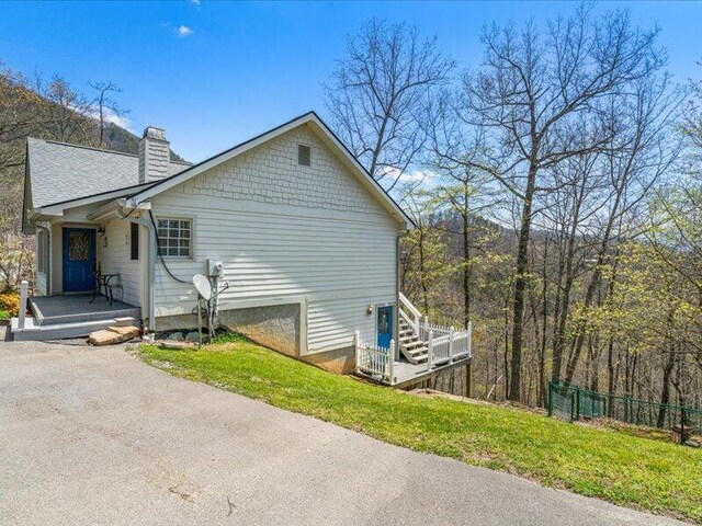 702 John Sevier Dr, Sevierville, TN 37876 - view of home's exterior featuring fence and a chimney