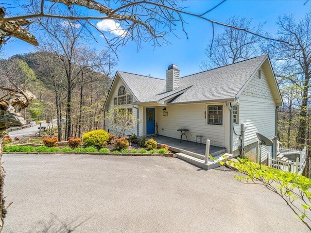 702 John Sevier Dr, Sevierville, TN 37876 - view of front of property featuring a shingled roof and a chimney