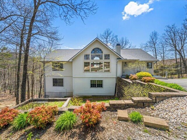 702 John Sevier Dr, Sevierville, TN 37876 - back of house with a chimney