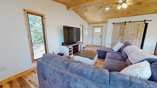 living room featuring ceiling fan, a barn door, vaulted ceiling with beams, wood-type flooring, and wood ceiling