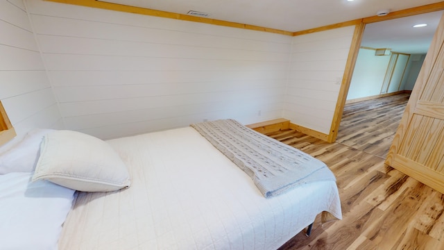 bedroom featuring wood-type flooring