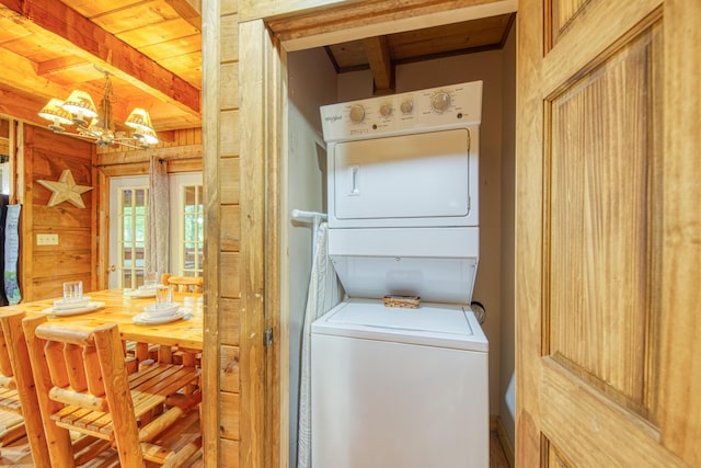 1136 E Foothills Dr, Gatlinburg, TN 37738 - laundry room with stacked washing machine and dryer and a chandelier