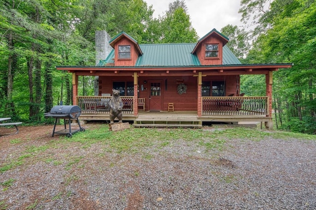 1136 E Foothills Dr, Gatlinburg, TN 37738 - view of front facade featuring metal roof and a chimney