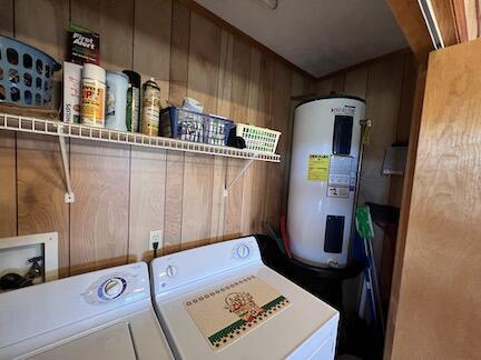 515 Mountain Lake Way, Newport, TN 37821 - laundry room featuring independent washer and dryer, laundry area, wood walls, and electric water heater