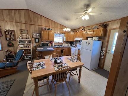 515 Mountain Lake Way, Newport, TN 37821 - dining space with wood walls, a textured ceiling, vaulted ceiling, and ceiling fan