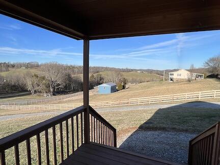 515 Mountain Lake Way, Newport, TN 37821 - deck with a rural view, fence, and an outbuilding