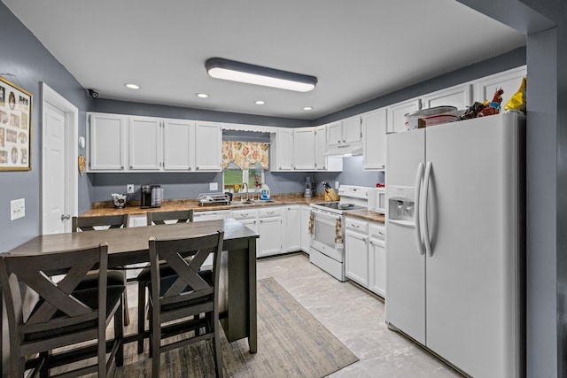 1400 Lakeview Cir, Morristown, TN 37814 - kitchen featuring white appliances, white cabinets, recessed lighting, light countertops, and under cabinet range hood