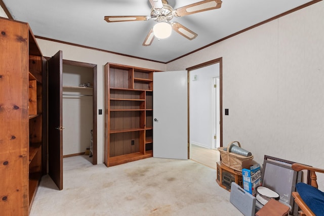 bedroom with ceiling fan, crown molding, light carpet, and a closet