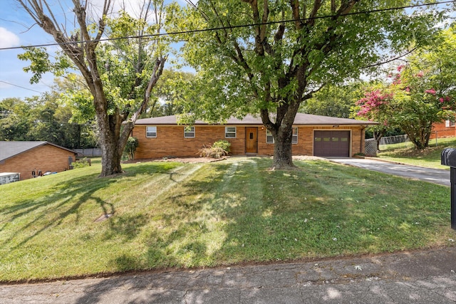 209 Pocahontas St, Newport, TN 37821 - ranch-style home featuring a front yard and a garage