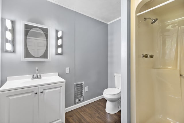 209 Pocahontas St, Newport, TN 37821 - bathroom featuring a shower, crown molding, toilet, vanity, and hardwood / wood-style flooring