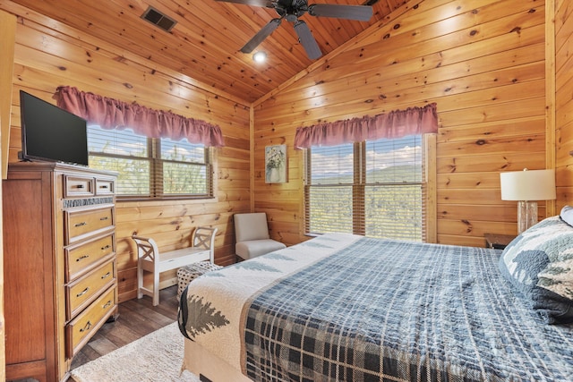 bedroom featuring dark hardwood / wood-style flooring, wood ceiling, vaulted ceiling, and wood walls