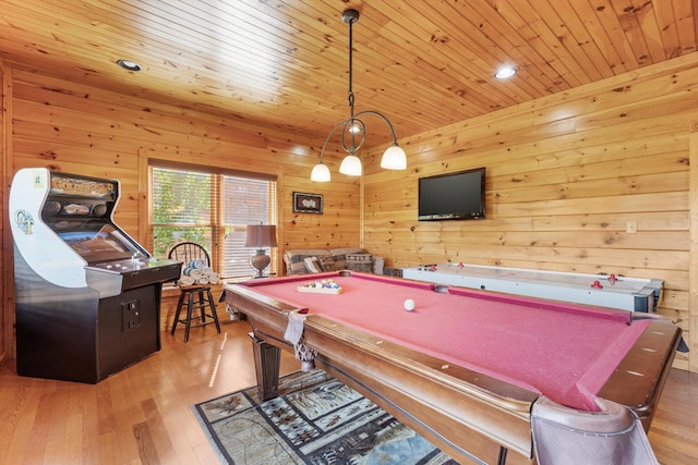 playroom featuring pool table, wood walls, wood ceiling, and light hardwood / wood-style floors