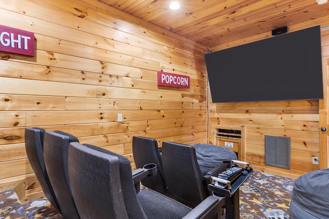 cinema room with wood ceiling and wooden walls