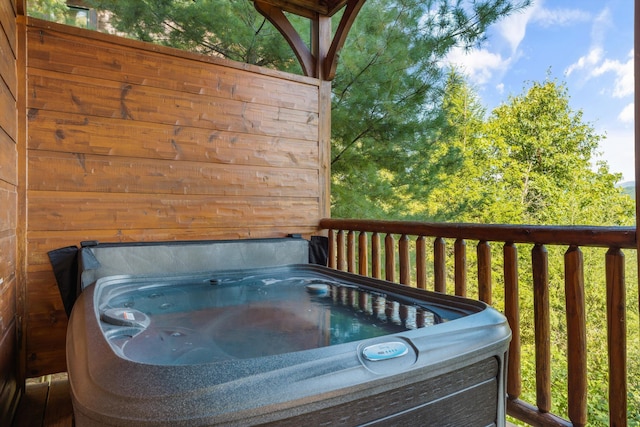 deck featuring a hot tub