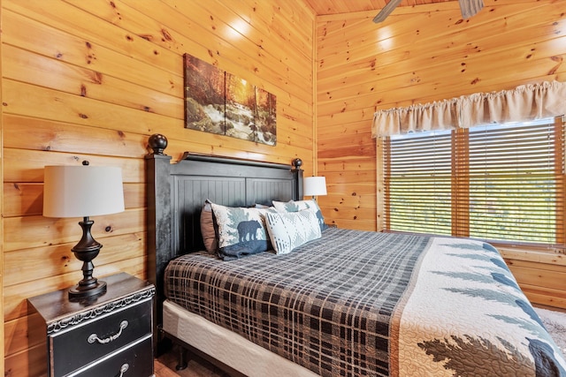 bedroom with wooden walls