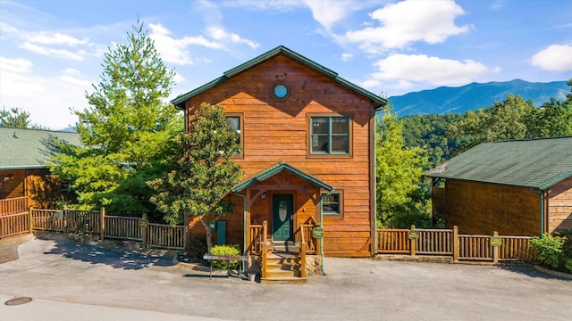 front of property featuring a mountain view