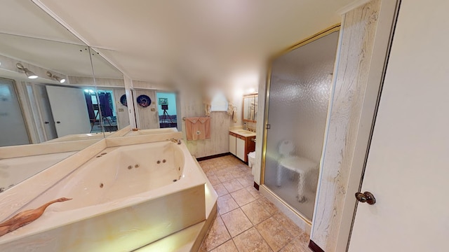 bathroom with shower with separate bathtub, vanity, and tile patterned floors