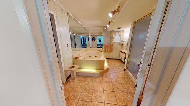 bathroom with a bathtub and tile patterned floors