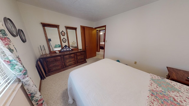 carpeted bedroom with a textured ceiling