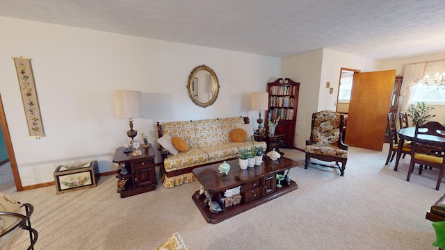 living room featuring an inviting chandelier, light colored carpet, and a textured ceiling