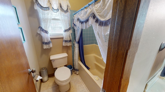 bathroom featuring shower / bath combo, tile patterned floors, and toilet