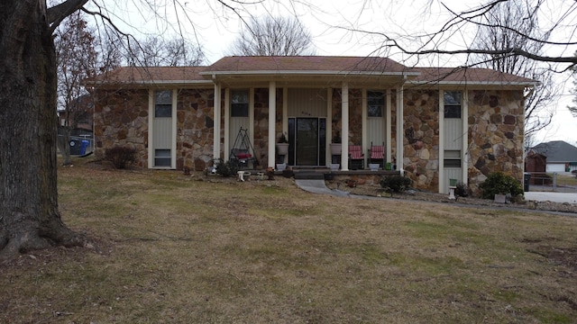 view of front of house with a front lawn and covered porch