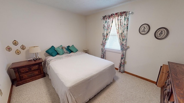 bedroom with light carpet