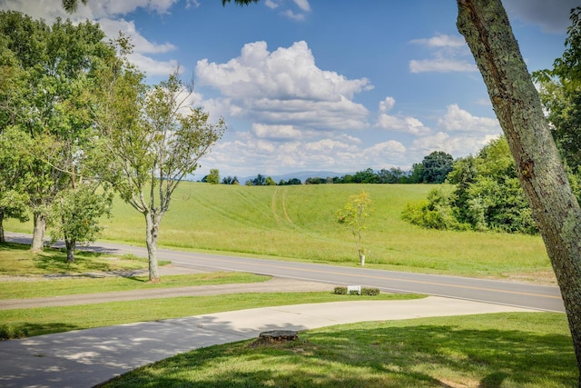 exterior space featuring a yard and a rural view