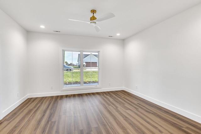 unfurnished room with ceiling fan and hardwood / wood-style floors