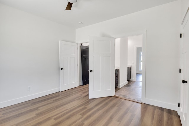 unfurnished bedroom with light hardwood / wood-style floors and ceiling fan