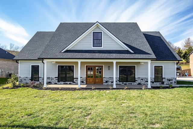 back of house featuring french doors, a yard, and a porch